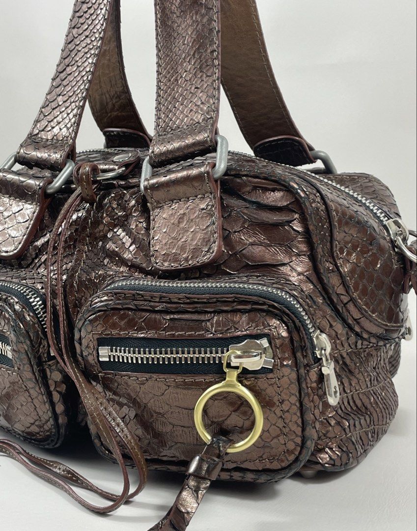 CHLOE BETTY (Category: Luxury Bags & Wallets) located in San Fernando. Submitted by larchivefeminine (Listing ID 1462646995, Image 3). Description: CHLOE BETTY IN VERY GOOD CONDITION MID 2000's MADE IN ITALY COLOR: BROWN / PHYTON ZIPPER: YKK MATERIAL:METALLIC / BRONZE PHYTON SKIN / GOLD AND SILVER , UTILITY POCKETS .