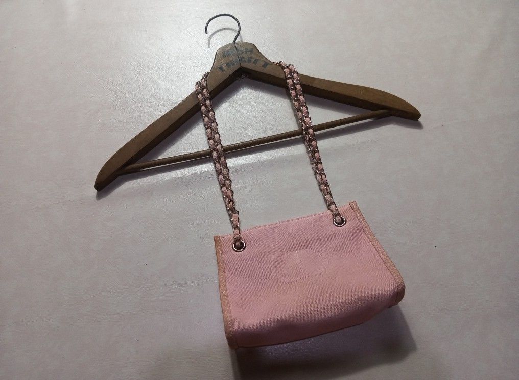 Christian Dior Beaute Canvas Shoulder Bag with Chain Strap Authentic (Category: Luxury Bags & Wallets) located in Urdaneta. Submitted by josephragontonjr95 (Listing ID 1462518852, Image 2). Description: - Christian Dior Beaute Embossed CD Canvas Shoulder Bag With Chain Strap Authentic - DIMENSIONS ⬇️ ⬇️ ⬇️ - WIDTH: 7 - LENGTH: 5 - COLOR RATE: 9.8/10 - ISSUES/FLAWS: NONE - CONDITION: EXCELLENT - Embossed CD logo on canvas material - Silver chain s