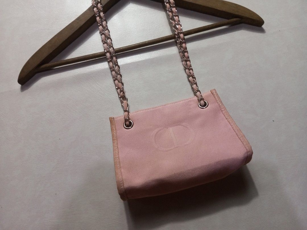 Christian Dior Beaute Canvas Shoulder Bag with Chain Strap Authentic (Category: Luxury Bags & Wallets) located in Urdaneta. Submitted by josephragontonjr95 (Listing ID 1462518852, Image 3). Description: - Christian Dior Beaute Embossed CD Canvas Shoulder Bag With Chain Strap Authentic - DIMENSIONS ⬇️ ⬇️ ⬇️ - WIDTH: 7 - LENGTH: 5 - COLOR RATE: 9.8/10 - ISSUES/FLAWS: NONE - CONDITION: EXCELLENT - Embossed CD logo on canvas material - Silver chain s