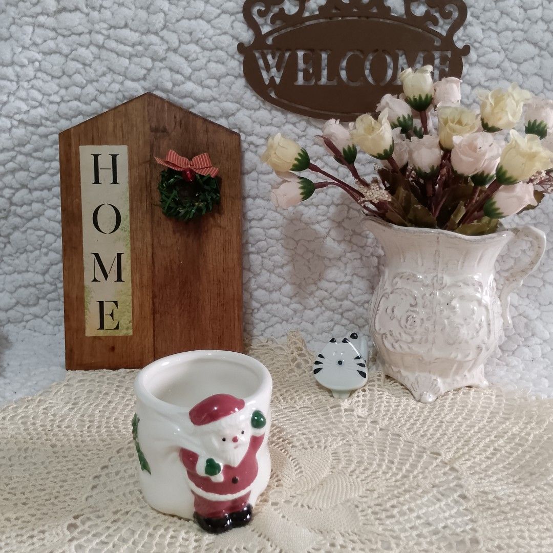 Christmas Mini Cup/Planter Penguin Figurine Candle Holder (Category: Other Home Decor) located in Tuguegarao City. Submitted by thriftedtreasures101.1 (Listing ID 1462534947, Image 3). Description: 65.00 each. 1. Ceramic candle holder 2. Santa mini cup or planter 3. Penguin Choir figurine. Slightly used, in good condition with a small flaw in the figurine as shown on the last picture (chip on the book of the middle penguin). May show usual signs 