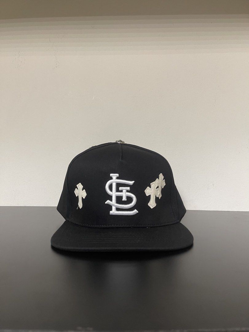 Chrome Hearts Black Snapback Cap with Crosses (Category: Caps & Hats) located in Manila. Submitted by mine2ownit (Listing ID 1462648793, Image 1). Description: - Brand: Chrome Hearts - Type: Snapback Cap - Color: Black - Features: Embroidered crosses and Chrome Hearts logo on front and back - Interior: Signature Chrome Hearts tape - Closure: Adjustable snapback - Style: Ideal for streetwear collections.