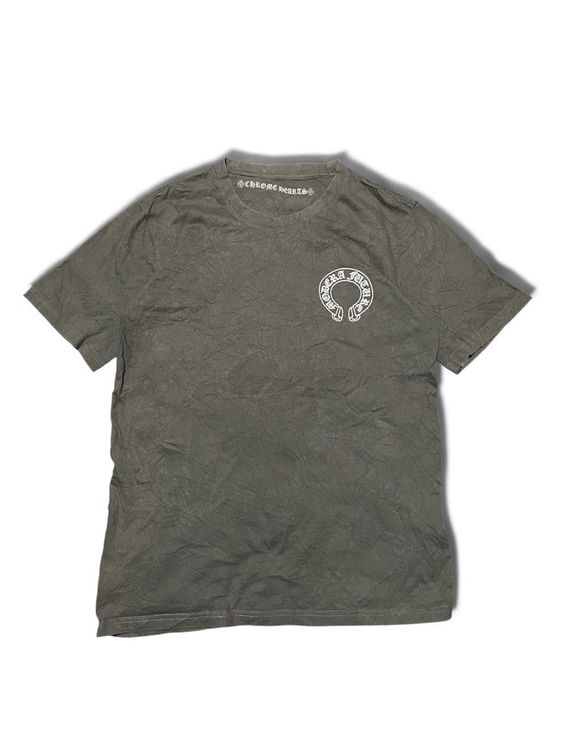 Chrome Hearts Modern Future T-Shirt Grey (Category: Tshirts & Polo Shirts ) located in Munoz. Submitted by bb_jimbo0 (Listing ID 1462625452, Image 1). Description: - Grey Chrome Hearts T-Shirt - 'CHROME HEARTS' logo on front chest - 'MODERN FUTURE' and 'D.C.R.' graphic on back - Short sleeves and crew neck design - Made from comfortable fabric - Ideal for everyday casual wear.