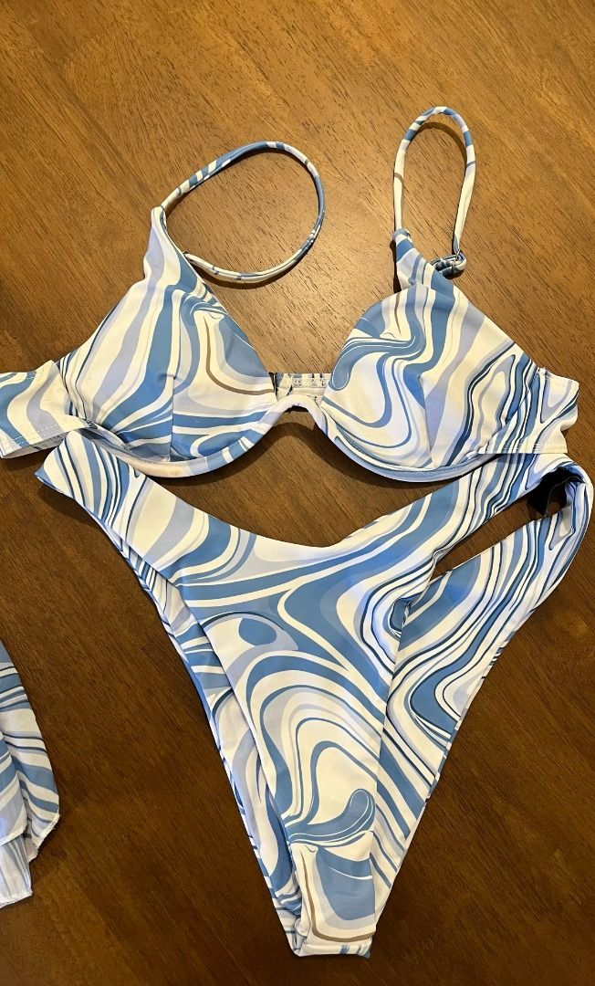Cider White and Blue Wave Underwire Bikini with Sarong / S (Category: Bikinis & Swimsuits) located in Pasig City. Submitted by precipitation_ (Listing ID 1462507203, Image 3). Description: DETAILS • Brand: Cider • Size: S • Color: White / blue • Wave print • Underwire bikini top • Matching sarong included • Original price: ₱1,417 • Worn around 3x • Condition: Excellent PAYMENT GCash / BPI / BDO / MariBank 📦 Shipping via courier, shouldered by bu