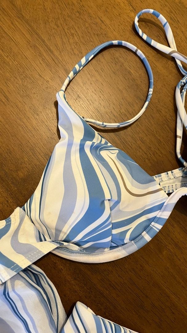 Cider White and Blue Wave Underwire Bikini with Sarong / S (Category: Bikinis & Swimsuits) located in Pasig City. Submitted by precipitation_ (Listing ID 1462507203, Image 2). Description: DETAILS • Brand: Cider • Size: S • Color: White / blue • Wave print • Underwire bikini top • Matching sarong included • Original price: ₱1,417 • Worn around 3x • Condition: Excellent PAYMENT GCash / BPI / BDO / MariBank 📦 Shipping via courier, shouldered by bu