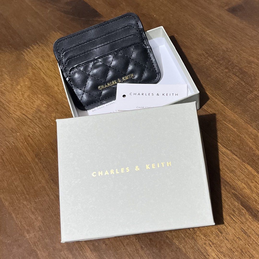 C&K Black Quilted Card Holder with Box (Category: Wallets & Card holders) located in Bacolod City. Submitted by tres_chic_bcd (Listing ID 1462606141, Image 2). Description: - Brand: c&k - Color: Black - Features: Multiple card slots - Hardware: Gold detail - Includes: box and tag - Benefit: Keeps your cards organized.