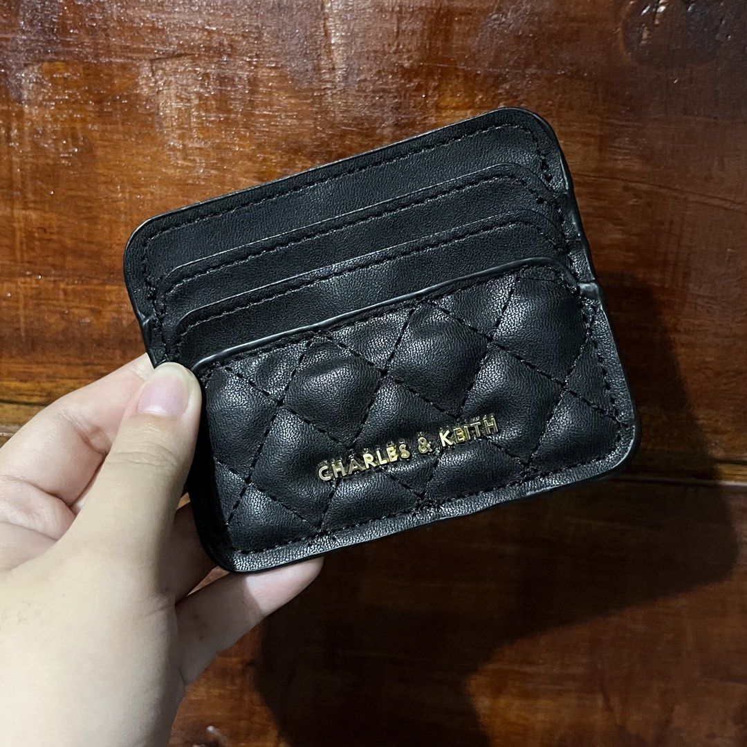 C&K Black Quilted Card Holder with Box (Category: Wallets & Card holders) located in Bacolod City. Submitted by tres_chic_bcd (Listing ID 1462606141, Image 3). Description: - Brand: c&k - Color: Black - Features: Multiple card slots - Hardware: Gold detail - Includes: box and tag - Benefit: Keeps your cards organized.