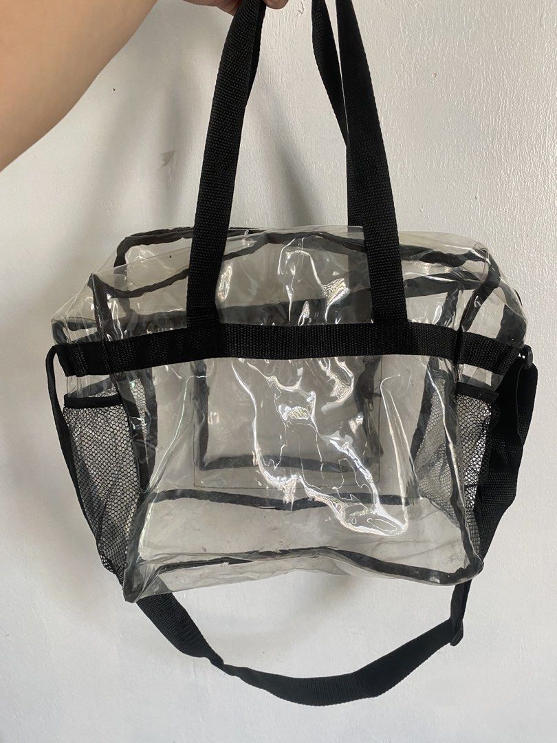 Clear Transparent Tote Bag with Pockets and Strap (Category: Tote Bags) located in Binan City. Submitted by prelovedlagunaph (Listing ID 1462620611, Image 3). Description: - See-through clear tote bag for easy visibility of contents - Multiple exterior pockets, including convenient side mesh pockets - Secure zip-top main compartment - Versatile carrying options: comfortable top handles and a detachable shoulder strap - Ideal for travel, gym, or e