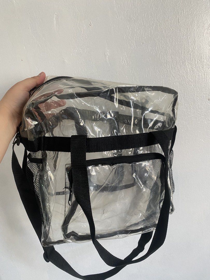 Clear Transparent Tote Bag with Pockets and Strap (Category: Tote Bags) located in Binan City. Submitted by prelovedlagunaph (Listing ID 1462620611, Image 2). Description: - See-through clear tote bag for easy visibility of contents - Multiple exterior pockets, including convenient side mesh pockets - Secure zip-top main compartment - Versatile carrying options: comfortable top handles and a detachable shoulder strap - Ideal for travel, gym, or e