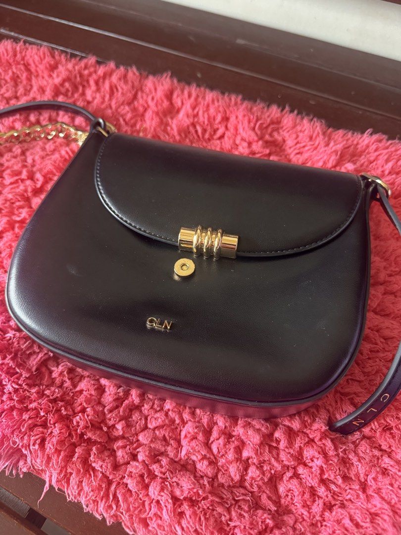 CLN Black Leather Paulette Bag (Category: Shoulder Bags) located in Vigan. Submitted by iamasteria (Listing ID 1462447257, Image 2). Description: - Brand: CLN - Color: Black - Strap: Gold chain strap with embossed CLN logo - Closure: Gold clasp - Interior: Multiple compartments for organization - Versatile: Ideal for everyday use or evening events - Issue: Minor scratches on gold hardware - Bought this P1,500.