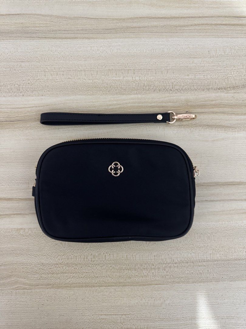 CLN Black Pouch with Wrist Strap (Category: Purses & Pouches) located in Iligan City. Submitted by yzandrayvo70150 (Listing ID 1462643172, Image 1). Description: - Stylish black pouch with a gold zipper. - Features a separate zippered compartment for extra organization. - Comes with a convenient detachable wrist strap. - Ideal for keeping your essentials tidy. - Compact design fits easily into larger bags..