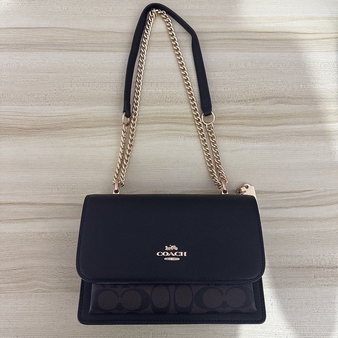 Coach Klare Shoulder Bag (Category: Luxury Bags & Wallets) located in Iligan City. Submitted by yzandrayvo70150 (Listing ID 1462643060, Image 1). Description: - Black Coach Shoulder Bag - Signature print on bottom flap - Elegant gold chain strap - Interior features: 1 zippered pocket, 2 open compartments - Clean inside and out - Versatile: Ideal for everyday errands or evening events.