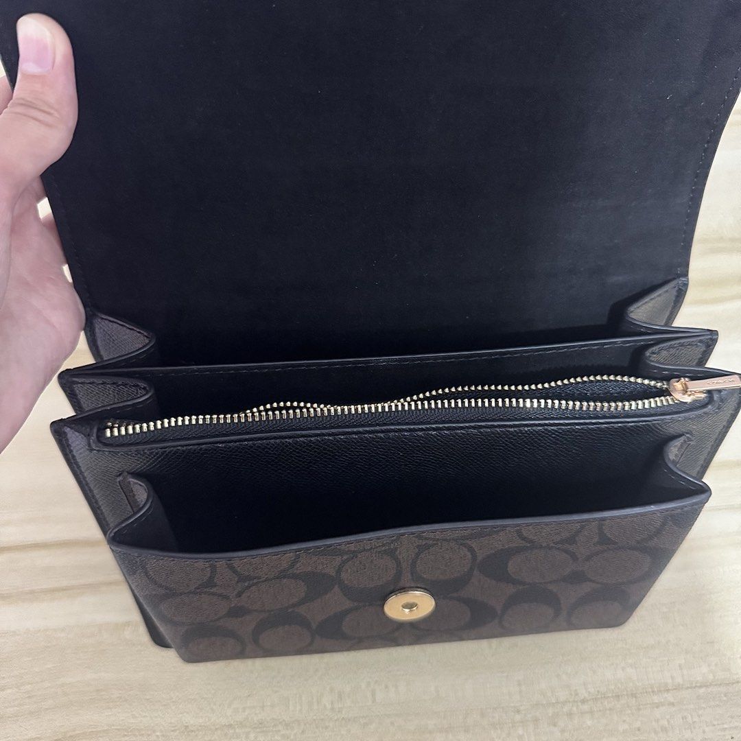 Coach Klare Shoulder Bag (Category: Luxury Bags & Wallets) located in Iligan City. Submitted by yzandrayvo70150 (Listing ID 1462643060, Image 3). Description: - Black Coach Shoulder Bag - Signature print on bottom flap - Elegant gold chain strap - Interior features: 1 zippered pocket, 2 open compartments - Clean inside and out - Versatile: Ideal for everyday errands or evening events.