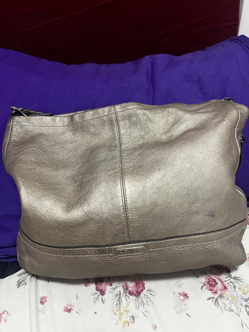 Coach Metallic Leather Hobo Bag (Category: Luxury Bags & Wallets) located in Antipolo. Submitted by happinessprelove (Listing ID 1462556741, Image 1). Description: - Coach hobo bag - Cool metallic pewter color - Genuine leather - Main zip compartment - Adjustable strap - Minor marks on leather (please check photos) - Great for everyday use.