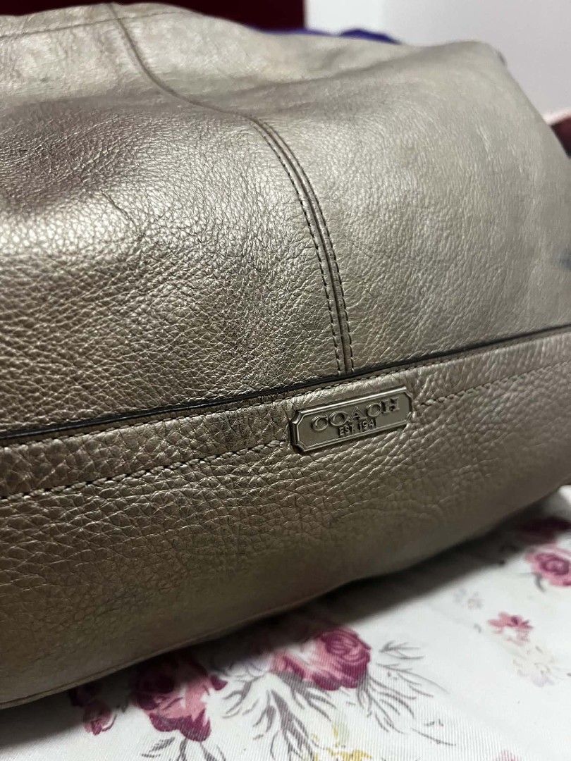 Coach Metallic Leather Hobo Bag (Category: Luxury Bags & Wallets) located in Antipolo. Submitted by happinessprelove (Listing ID 1462556741, Image 3). Description: - Coach hobo bag - Cool metallic pewter color - Genuine leather - Main zip compartment - Adjustable strap - Minor marks on leather (please check photos) - Great for everyday use.