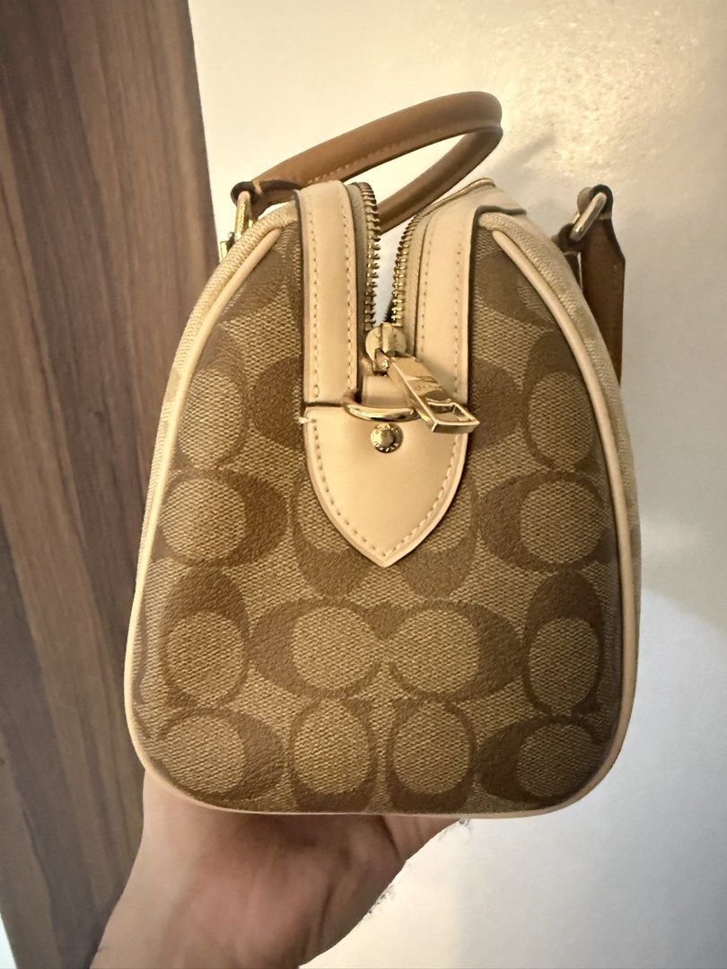 Coach Monogram Canvas Leather Bag (Category: Luxury Bags & Wallets) located in Dasmarinas. Submitted by rjrjrj114 (Listing ID 1462634560, Image 2). Description: - Classic Coach monogram canvas - Tan leather trim and handles - Gold-tone hardware - Zip closure - Interior zip pocket and slip pockets - Great everyday bag Almost new.