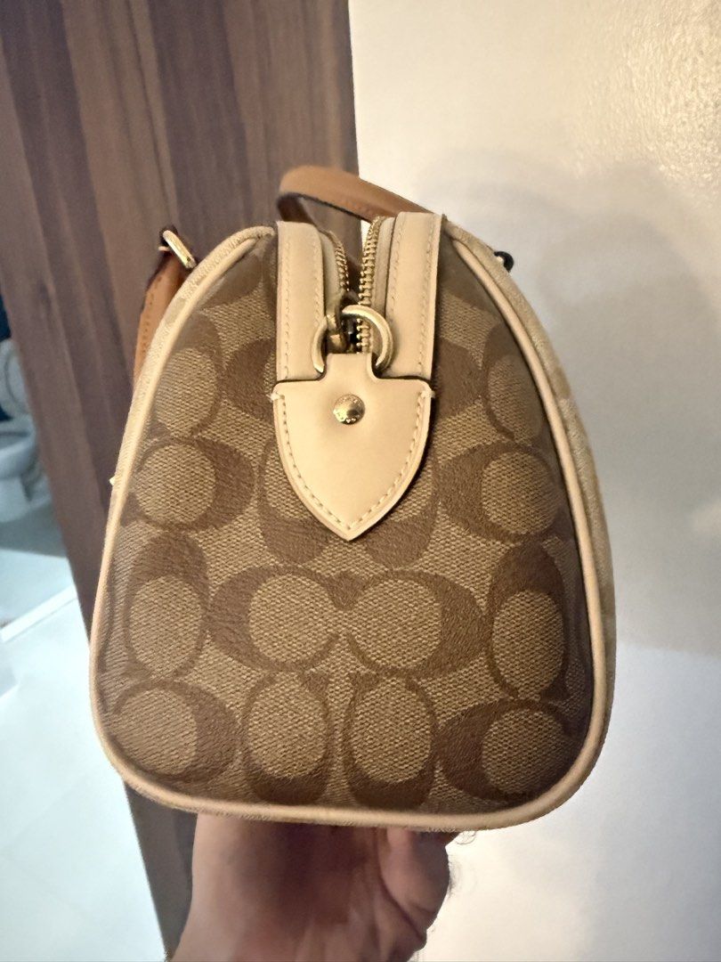 Coach Monogram Canvas Leather Bag (Category: Luxury Bags & Wallets) located in Dasmarinas. Submitted by rjrjrj114 (Listing ID 1462634560, Image 3). Description: - Classic Coach monogram canvas - Tan leather trim and handles - Gold-tone hardware - Zip closure - Interior zip pocket and slip pockets - Great everyday bag Almost new.