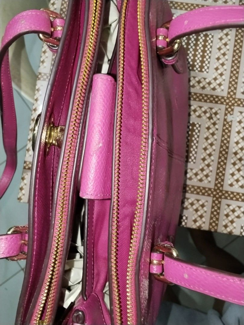 Coach Pink Leather Tote Bag (Category: Shoulder Bags) located in Manila. Submitted by bagelyascollection (Listing ID 1462612320, Image 3). Description: - Authentic Coach pink leather tote bag - Elegant gold hardware details - Secure zipper closure - Spacious interior with multiple compartments - Made in Vietnam.