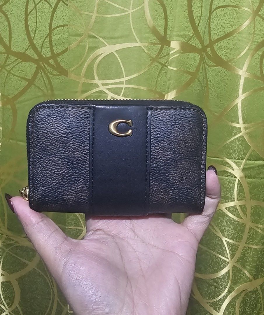 Coach Zip Around Coin Pouch Wallet (Category: Luxury Bags & Wallets) located in Baguio. Submitted by msgold2601 (Listing ID 1462585030, Image 1). Description: - Authentic Coach coin pouch - Secure zip-around closure - Multiple interior compartments for organization - Ideal for storing cards and coins - Compact size, fits easily in pockets or small bags - Elegant gold tone hardware.