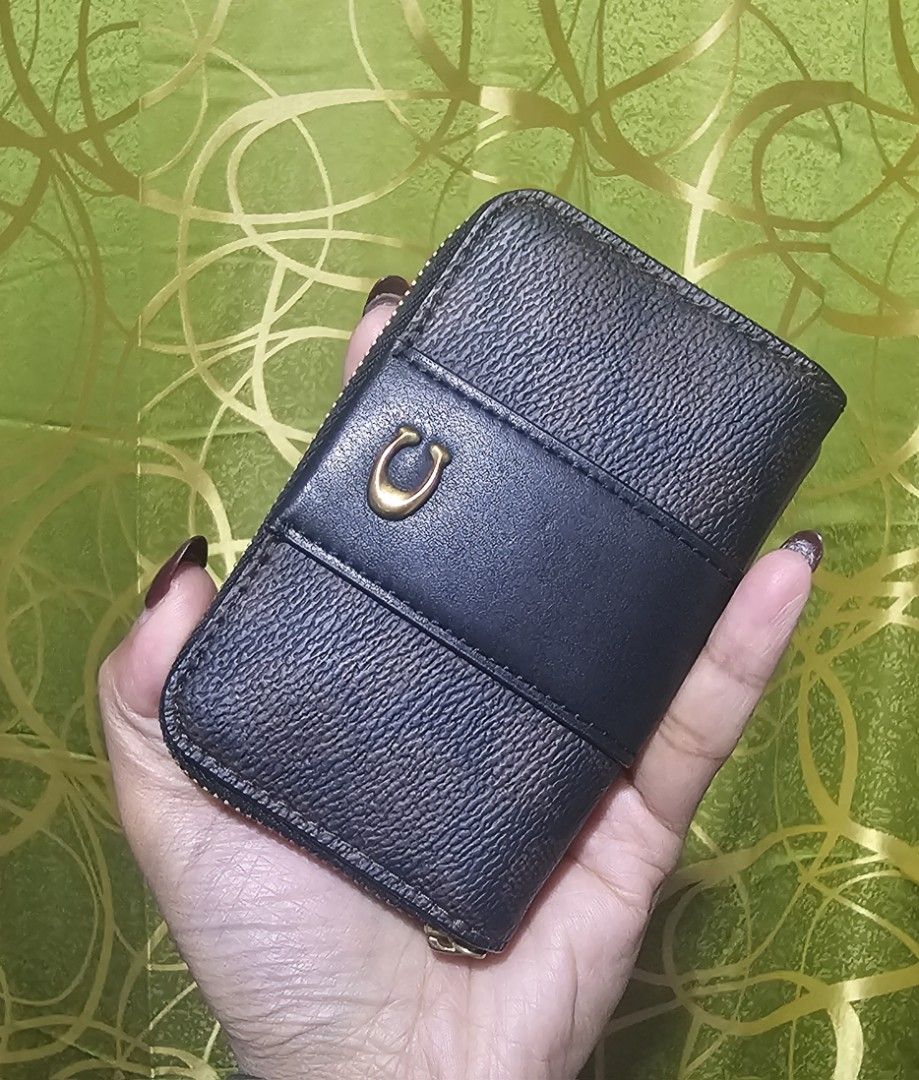 Coach Zip Around Coin Pouch Wallet (Category: Luxury Bags & Wallets) located in Baguio. Submitted by msgold2601 (Listing ID 1462585030, Image 3). Description: - Authentic Coach coin pouch - Secure zip-around closure - Multiple interior compartments for organization - Ideal for storing cards and coins - Compact size, fits easily in pockets or small bags - Elegant gold tone hardware.