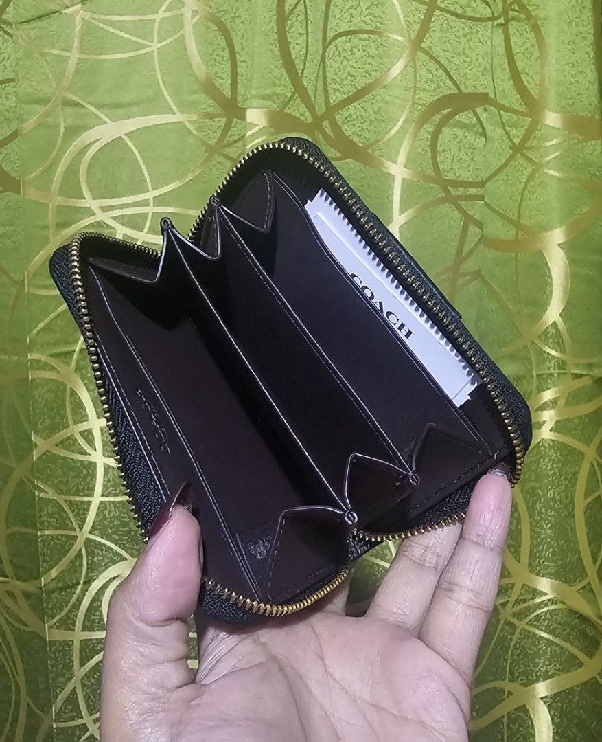 Coach Zip Around Coin Pouch Wallet (Category: Luxury Bags & Wallets) located in Baguio. Submitted by msgold2601 (Listing ID 1462585030, Image 2). Description: - Authentic Coach coin pouch - Secure zip-around closure - Multiple interior compartments for organization - Ideal for storing cards and coins - Compact size, fits easily in pockets or small bags - Elegant gold tone hardware.