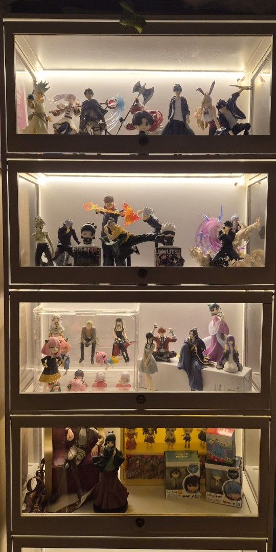 Anime Figures (JJK, AOT, SOLO LEVELING, ETC) (Category: Figurines & Statues) located in San Pedro. Submitted by byeonhazel (Listing ID 1462573178, Image 1). Description: - Collection of anime figures for sale - Features characters from Jujutsu Kaisen, Spy x Family, and other popular mangas - Figures have been displayed in a lighted cabinet - Includes both boxed and out-of-box figures - Ideal for anime enthusiasts and collectors - Can be sold for 