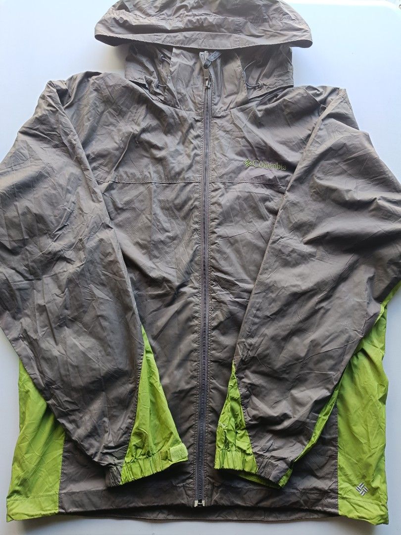 Columbia Lightweight Hooded Windbreaker Jacket (Category: Coats, Jackets and Outerwear) located in Baguio. Submitted by wear_mo_clothing_shop (Listing ID 1462513564, Image 1). Description: - Columbia windbreaker jacket - Lightweight and packable - Hooded with full zip closure - Two-tone brown and lime green - Zipped pockets for secure storage - Ideal for outdoor activities and everyday wear.