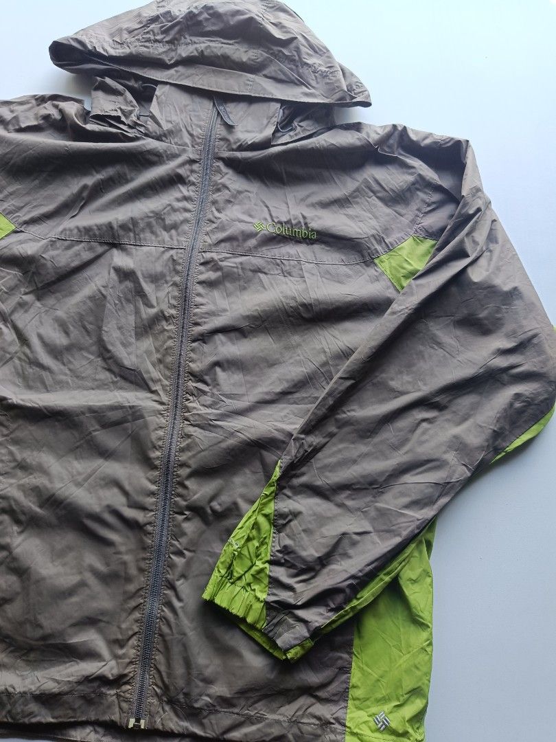 Columbia Lightweight Hooded Windbreaker Jacket (Category: Coats, Jackets and Outerwear) located in Baguio. Submitted by wear_mo_clothing_shop (Listing ID 1462513564, Image 3). Description: - Columbia windbreaker jacket - Lightweight and packable - Hooded with full zip closure - Two-tone brown and lime green - Zipped pockets for secure storage - Ideal for outdoor activities and everyday wear.