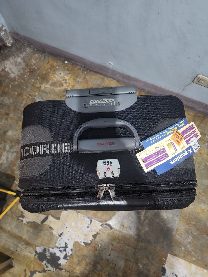 Concorde World Class Black Expandable Luggage (Category: Luggage) located in Malabon City. Submitted by grfpx (Listing ID 1462550226, Image 2). Description: - Concorde World Class luggage - Durable black fabric exterior - Expandable design for extra packing space - Retractable handle and smooth-rolling wheels for easy mobility - Built-in combination lock for security - Ideal for all your travel needs.