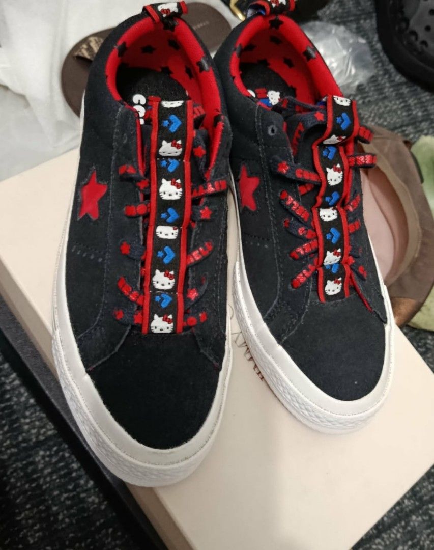 Converse x Hello Kitty (Category: Sneakers) located in Paranaque City. Submitted by calm_youngstore7 (Listing ID 1462558007, Image 1). Description: PRICE CUT! Converse x Hello Kitty One Star OX low-top sneakers in black suede, featuring a bright red star on the side and playful character graphics along the tongue webbing Limited-edition Converse x Hello Kitty One Star Ox (Black/Fiery Red/White) sneakers, identified by product code 163904C Origina