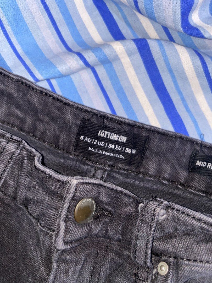 Cotton On Black Denim Distressed Shorts (Category: Shorts) located in Makati City. Submitted by fashionangel.222 (Listing ID 1462638230, Image 3). Description: - Brand: Cotton On - Color: Black - Style: Mid-rise denim shorts - Features: Frayed hem, distressed detailing on pockets - Closure: Button and zip - Fits up to S.