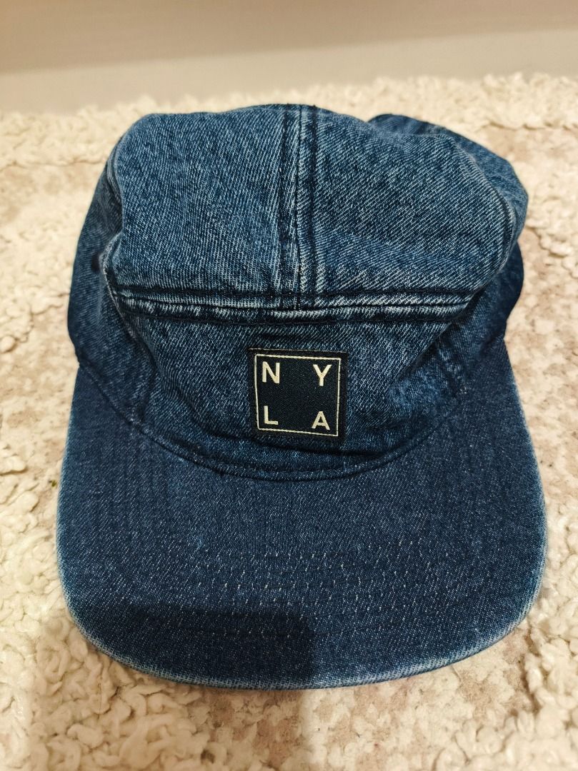 Cotton On Denim 5 Panel Cap NYLA (Category: Caps & Hats) located in Caloocan City. Submitted by adidaszler (Listing ID 1462597365, Image 1). Description: - Cotton On 5-panel denim cap - Features "NYLA" patch on front - Adjustable strap with metal buckle at the back - Classic blue denim wash.