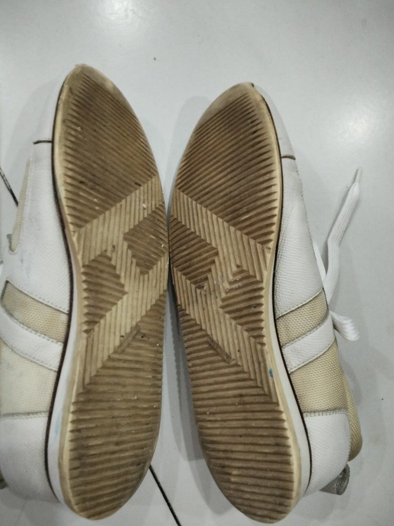 Cream and White Sneakers (Category: Sneakers) located in Manila. Submitted by jeansuaco942346 (Listing ID 1462458309, Image 3). Description: - Cream canvas sneakers - White leather accents - Lace-up style - Soles show some wear - Minor marks on canvas - Ideal for casual wear.