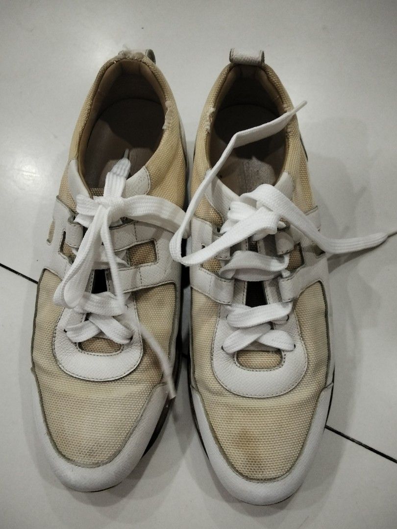 Cream and White Sneakers (Category: Sneakers) located in Manila. Submitted by jeansuaco942346 (Listing ID 1462458309, Image 1). Description: - Cream canvas sneakers - White leather accents - Lace-up style - Soles show some wear - Minor marks on canvas - Ideal for casual wear.