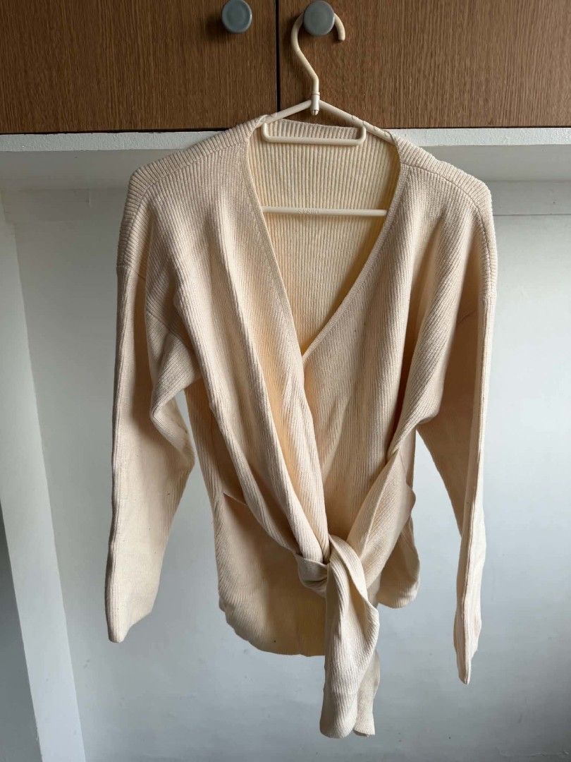 Cream Ribbed Knit Wrap Cardigan (Category: Coats, Jackets and Outerwear) located in Manila. Submitted by atozstuff (Listing ID 1462446947, Image 2). Description: - Cream colored ribbed knit cardigan - Wrap style with tie detail - Long sleeves - Super comfy and versatile - Can be worn open or tied - Great for layering.