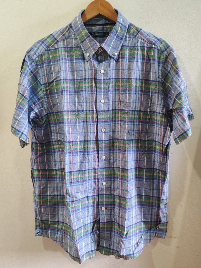 CREMEUX Short Sleeve Plaid Button Down Shirt (Category: Formal Shirts) located in Cavite. Submitted by purelabels_alexandsofia (Listing ID 1462451827, Image 3). Description: - CREMEUX short sleeve button down shirt - Classic blue, green, and pink plaid pattern -Size shoulder to shoulder 19 inches/28.5 length -Size on tag Large -used like new - no flaws - Features a button collar - Versatile for casual or slightly dressed-up looks.