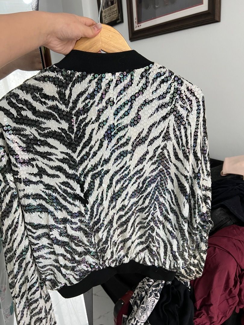 CRISCIONE Sequin Zebra Print Bomber Jacket (Category: Coats, Jackets and Outerwear) located in Baguio. Submitted by pureearth.5f1c08 (Listing ID 1462550232, Image 2). Description: - Unique zebra print bomber jacket - All-over sequin embellishments - Black ribbed cuffs and hem - Front zipper closure - Fully lined in black - Perfect statement piece for any outfit - Fun and eye-catching design.