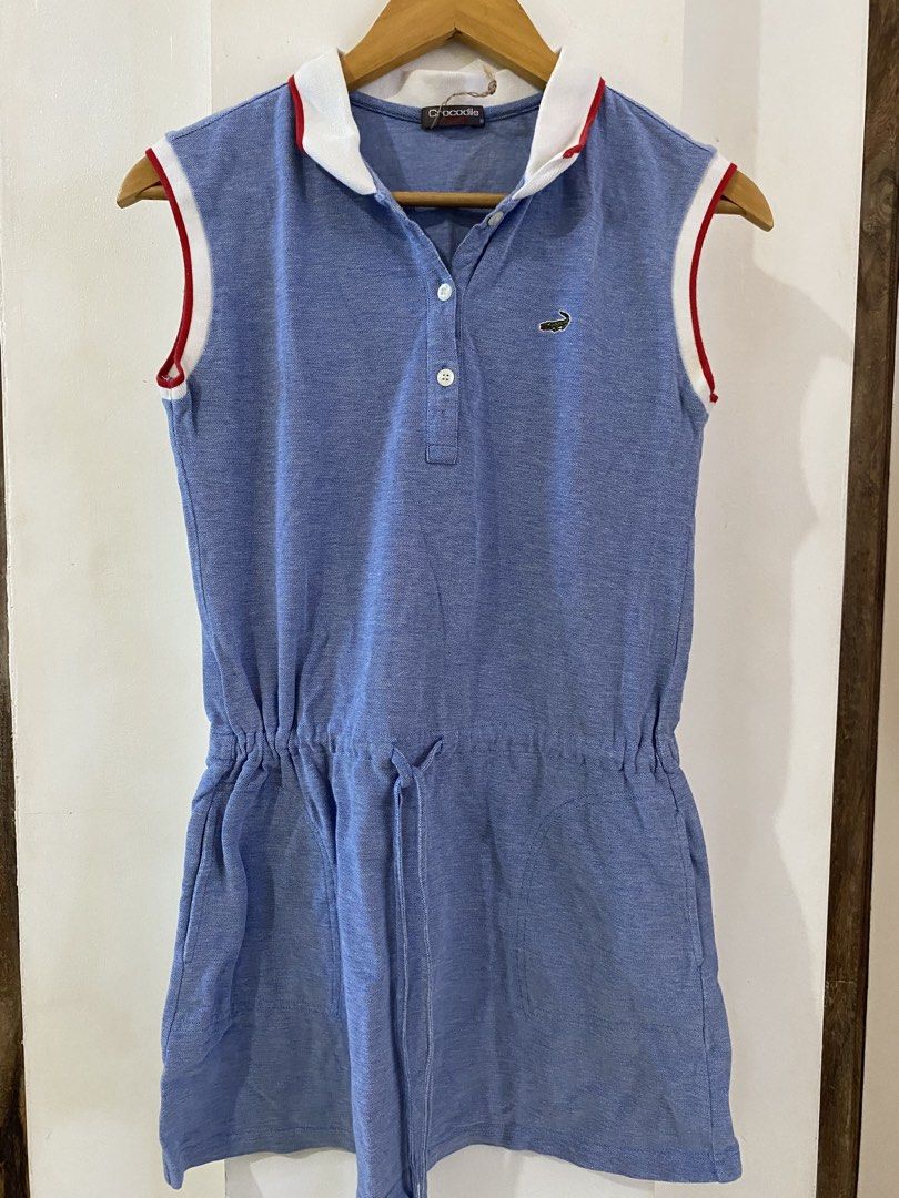 Crocodile Blue Sleeveless Drawstring Polo Dress (Category: Dresses) located in Caloocan City. Submitted by bethanylum77364 (Listing ID 1462623348, Image 1). Description: - Blue sleeveless polo dress from Crocodile - Features a drawstring waist for a customizable fit - White collar with red trim - Small Crocodile logo embroidered on the chest - Button-up neckline - Ideal for casual wear.