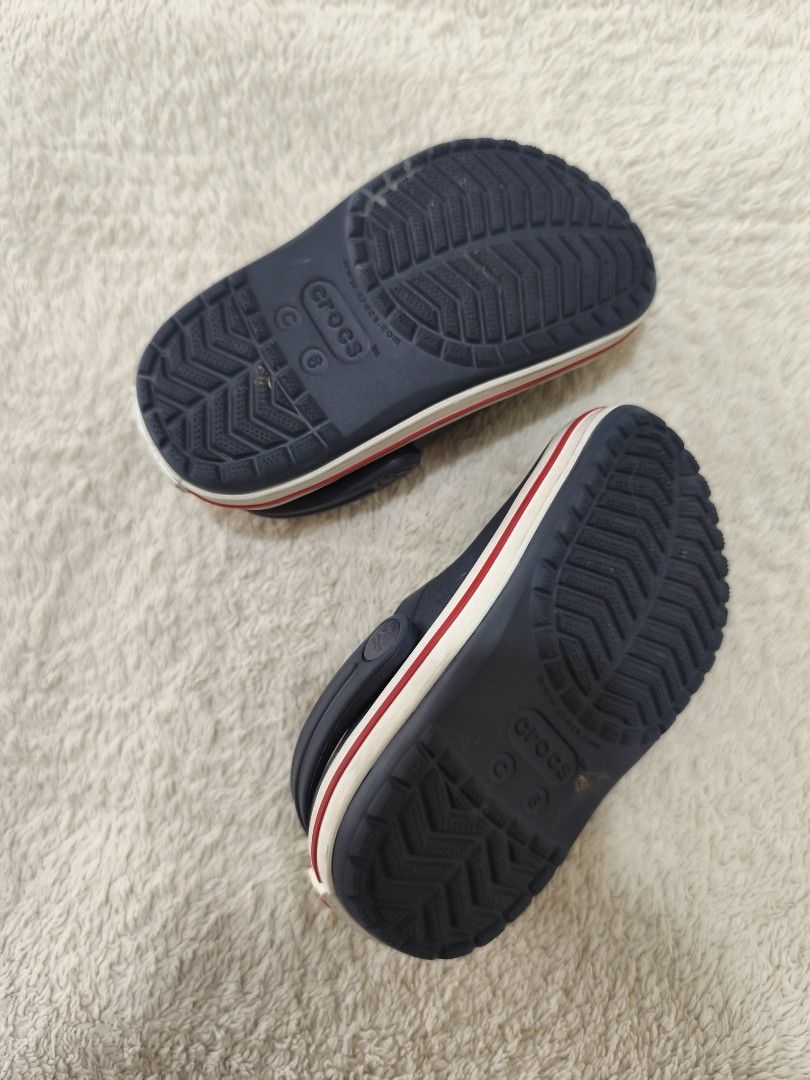 Crocs Junior Crocband Clog in Navy Red (Category: Babies & Kids Fashion) located in Pasig City. Submitted by mmdaswani (Listing ID 1462453162, Image 3). Description: Crocs Junior Crocband Clog in Navy Red in size C6 (13.2 cm or 5.1 in) Original Price: PHP 2,800 RFS: loved but outgrown.