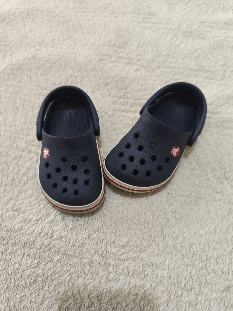 Crocs Junior Crocband Clog in Navy Red (Category: Babies & Kids Fashion) located in Pasig City. Submitted by mmdaswani (Listing ID 1462453162, Image 1). Description: Crocs Junior Crocband Clog in Navy Red in size C6 (13.2 cm or 5.1 in) Original Price: PHP 2,800 RFS: loved but outgrown.