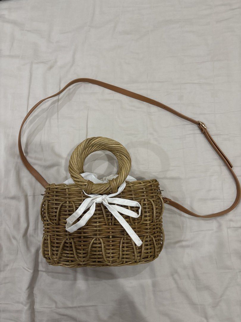 Cute Woven Bag with Handle and Strap (Category: Shoulder Bags) located in Paranaque City. Submitted by kaescloset.18 (Listing ID 1462578920, Image 1). Description: - used once for a wedding - Stylish woven bag - Features a round top handle - Includes a long, adjustable strap - White drawstring closure inside - Fits essentials like phone, wallet, and keys.