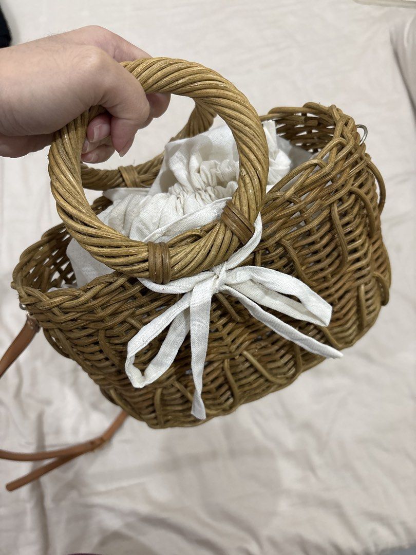 Cute Woven Bag with Handle and Strap (Category: Shoulder Bags) located in Paranaque City. Submitted by kaescloset.18 (Listing ID 1462578920, Image 2). Description: - used once for a wedding - Stylish woven bag - Features a round top handle - Includes a long, adjustable strap - White drawstring closure inside - Fits essentials like phone, wallet, and keys.