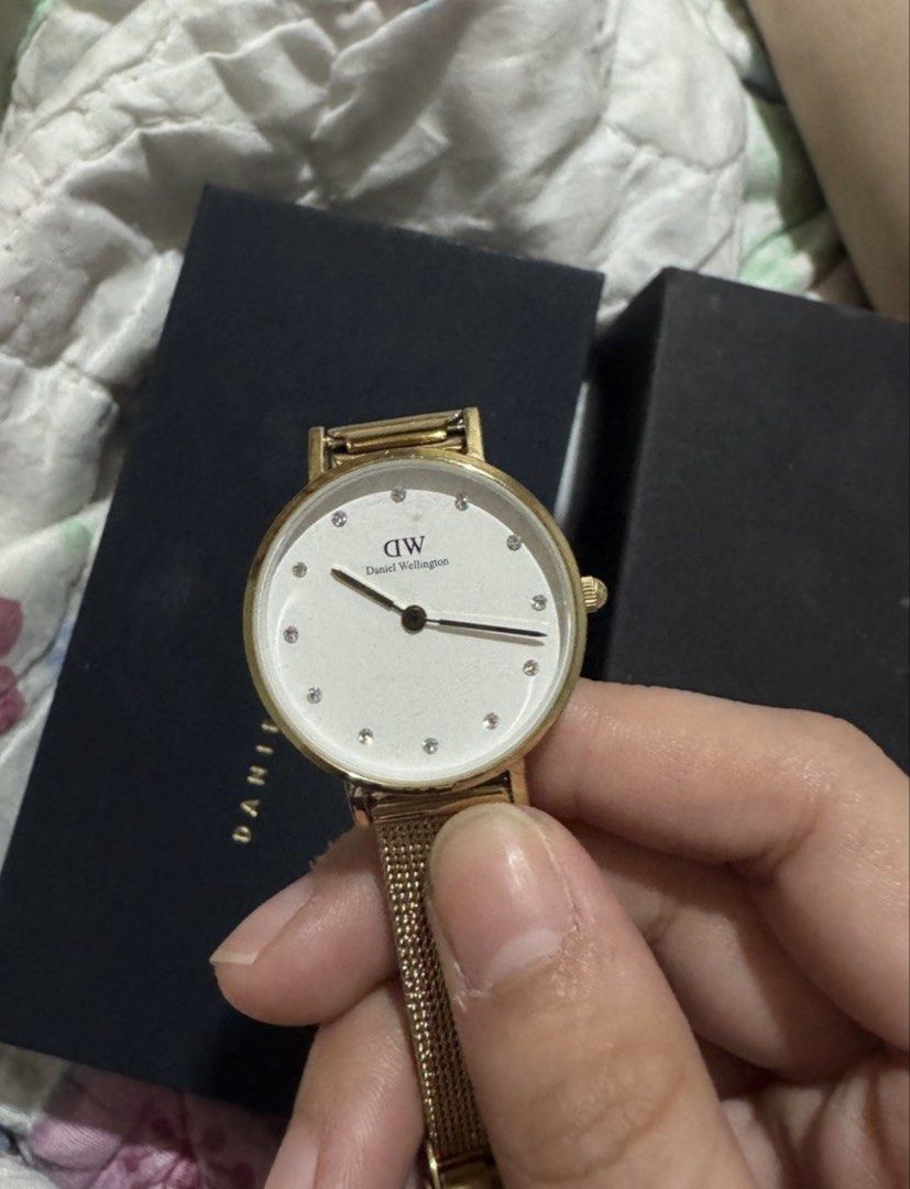 Daniel Wellington Gold Mesh Watch with White Dial (Category: Women's Watches) located in Marikina City. Submitted by prettytaurus18 (Listing ID 1462511476, Image 1). Description: - Authentic Gold Daniel Wellington Watch - Elegant White Dial with Diamond Markers - Adjustable Stainless Steel Mesh Strap - Comes with Original Daniel Wellington Box - Perfect for Casual or Formal Wear.