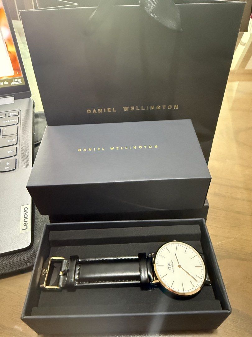DANIEL WELLINGTON WATCH 40mm (Category: Men's Watches) located in Paranaque City. Submitted by lulusthreadsandthings (Listing ID 1462651714, Image 2). Description: ⌚ AUTHENTIC DANIEL WELLINGTON CLASSIC 40MM — ROSE GOLD Selling Daniel Wellington Classic Sheffield 40mm, model B40R1 / DW00100009. 🤍 White/Eggshell dial 🌹 Rose-gold-tone case 🖤 Genuine black leather strap 📦 Original Daniel Wellington box included ✨ Classic minimalist design 🔋 Quar