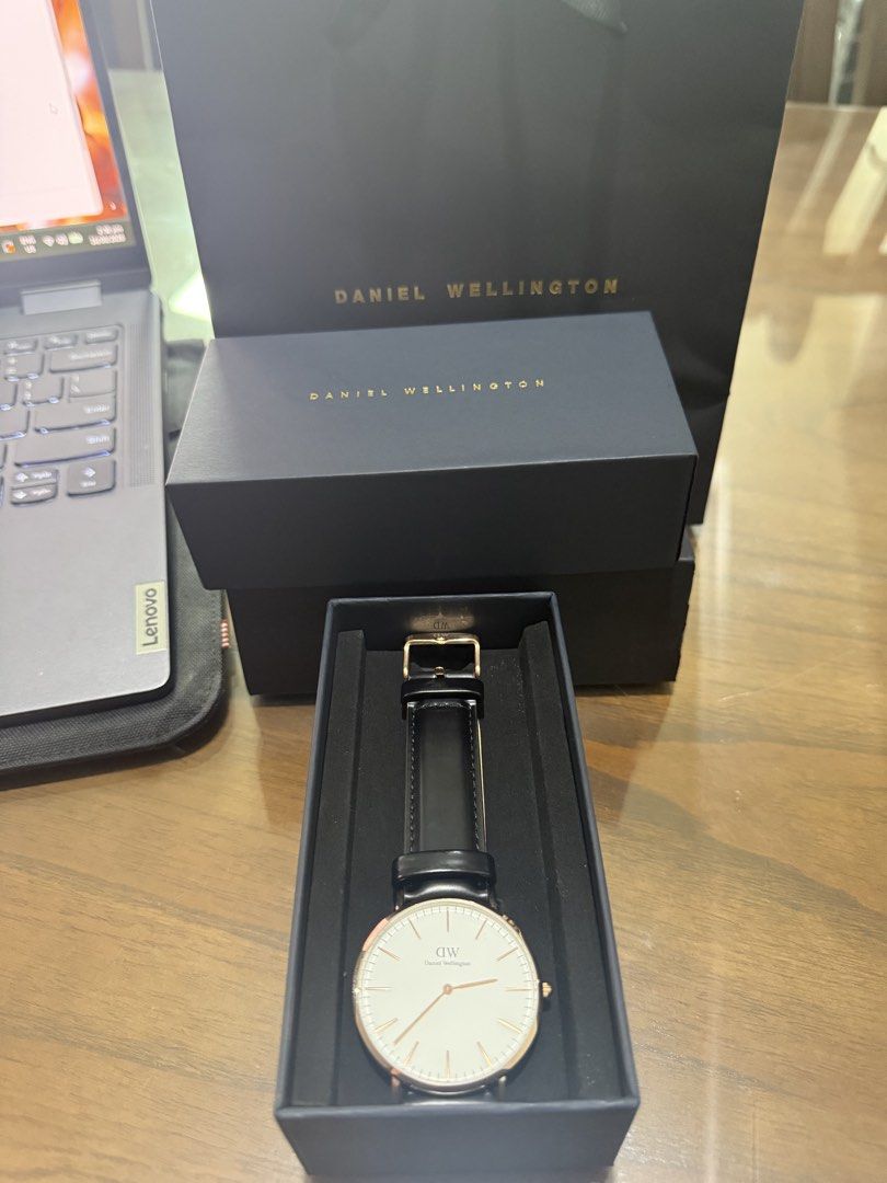 DANIEL WELLINGTON WATCH 40mm (Category: Men's Watches) located in Paranaque City. Submitted by lulusthreadsandthings (Listing ID 1462651714, Image 1). Description: ⌚ AUTHENTIC DANIEL WELLINGTON CLASSIC 40MM — ROSE GOLD Selling Daniel Wellington Classic Sheffield 40mm, model B40R1 / DW00100009. 🤍 White/Eggshell dial 🌹 Rose-gold-tone case 🖤 Genuine black leather strap 📦 Original Daniel Wellington box included ✨ Classic minimalist design 🔋 Quar