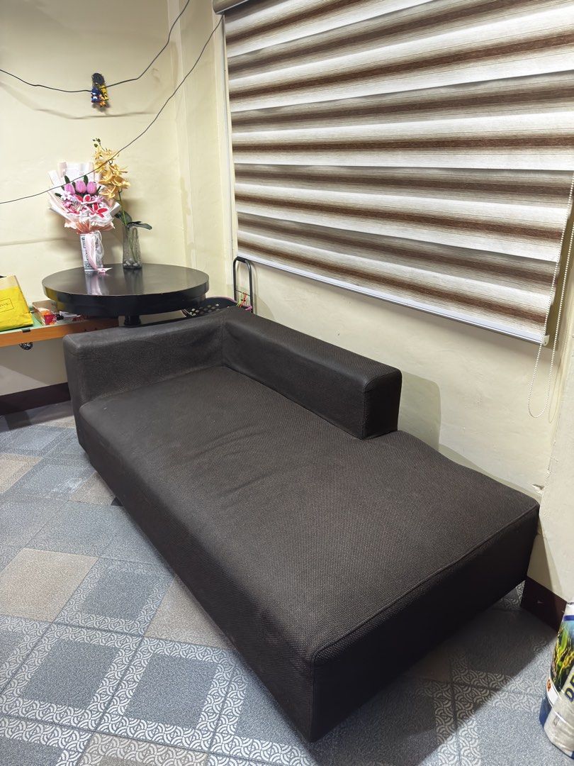 Dark Brown Chaise Lounge Sofa (Category: Sofas) located in Pasig City. Submitted by brosotocrysthel17 (Listing ID 1462559275, Image 2). Description: - Dark brown chaise lounge sofa - Comfortable and spacious - Fits well in most living spaces - Great for lounging or extra seating - Selling as is - Pick up only Slightly issue on the side.