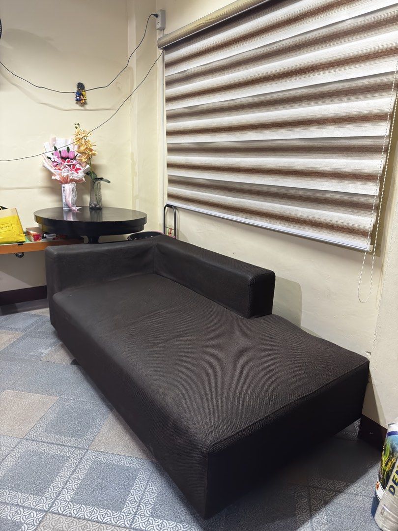 Dark Brown Chaise Lounge Sofa (Category: Sofas) located in Pasig City. Submitted by brosotocrysthel17 (Listing ID 1462559275, Image 3). Description: - Dark brown chaise lounge sofa - Comfortable and spacious - Fits well in most living spaces - Great for lounging or extra seating - Selling as is - Pick up only Slightly issue on the side.