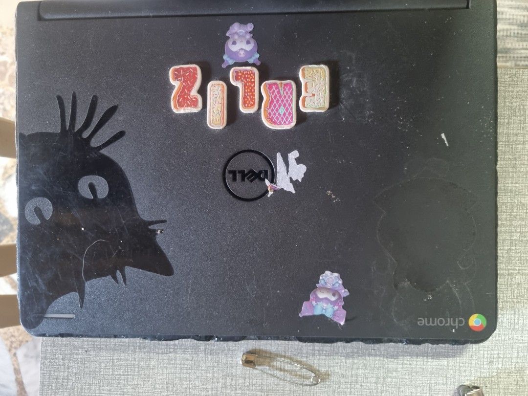 Dell Chromebook Laptop (Category: Laptops & Notebooks) located in Manila. Submitted by monya111 (Listing ID 1462472835, Image 1). Description: - Dell Chromebook laptop - Black casing with stickers - Screen displays YouTube (demonstrates functionality) - Black keyboard - Ideal for schoolwork and everyday use - Ready for a new owner.