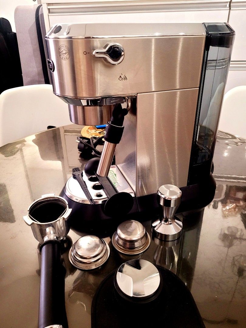 DeLonghi Espresso Machine with Accessories (Category: Coffee Machines & Makers) located in Manila. Submitted by hamsgenovs (Listing ID 1462474403, Image 2). Description: - DeLonghi espresso machine - Includes portafilter, tamper, and filter baskets - Detachable water tank for easy refilling - Ideal for brewing delicious coffee at home - Comes with a cleaning brush - Ready for its new owner - I bought it in Korea for Home habit. -The condition is 