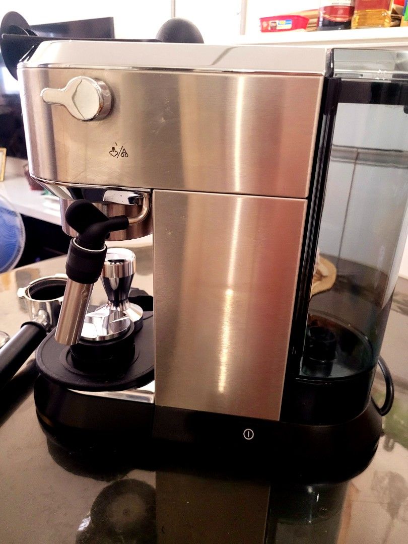 DeLonghi Espresso Machine with Accessories (Category: Coffee Machines & Makers) located in Manila. Submitted by hamsgenovs (Listing ID 1462474403, Image 3). Description: - DeLonghi espresso machine - Includes portafilter, tamper, and filter baskets - Detachable water tank for easy refilling - Ideal for brewing delicious coffee at home - Comes with a cleaning brush - Ready for its new owner - I bought it in Korea for Home habit. -The condition is 