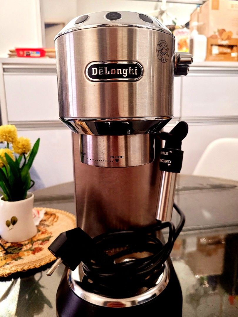 DeLonghi Espresso Machine with Accessories (Category: Coffee Machines & Makers) located in Manila. Submitted by hamsgenovs (Listing ID 1462474403, Image 1). Description: - DeLonghi espresso machine - Includes portafilter, tamper, and filter baskets - Detachable water tank for easy refilling - Ideal for brewing delicious coffee at home - Comes with a cleaning brush - Ready for its new owner - I bought it in Korea for Home habit. -The condition is 